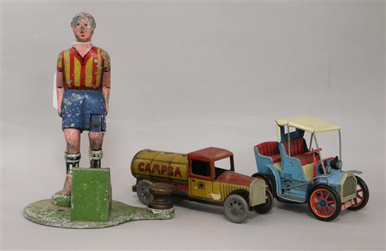 A metal footballer toy and a tin plate model of a car and tanker RSA